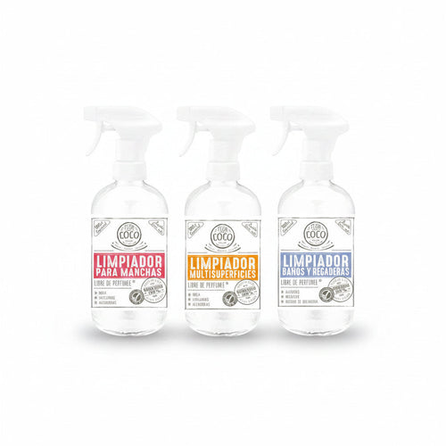 Flor de Coco cleaning kit with three refillable glass spray bottles: stain remover, multi-surface cleaner, and bathroom cleaner.