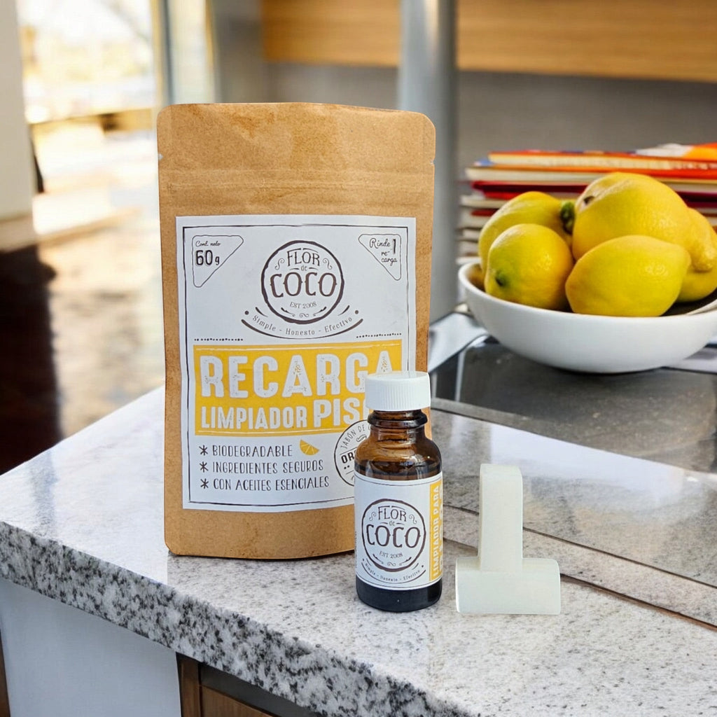 Flor de Coco refill for natural citrus floor cleaner, includes soap tablets and essential oil. Biodegradable, safe ingredients.