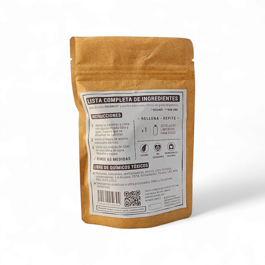 Flor de Coco refill for natural citrus floor cleaner, includes soap tablets and essential oil. Vegan, biodegradable, safe ingredients.
